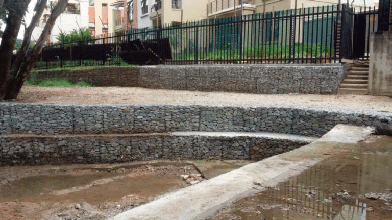 Completed boundary wall, retaining side wall and weir